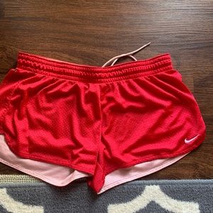 Red Nike athletic shorts